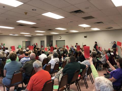 At Republican Rep. Brandon Williams’s (NY-22) town hall, Indivisible Onondaga County protested the event by holding coordinated signs to put pressure on the freshman Republican congressman to support a clean debt ceiling hike.