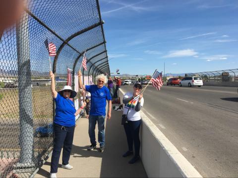 Indivisible ABQ held banners over a highway overpass near downtown Albuquerque – getting many honks and waves!